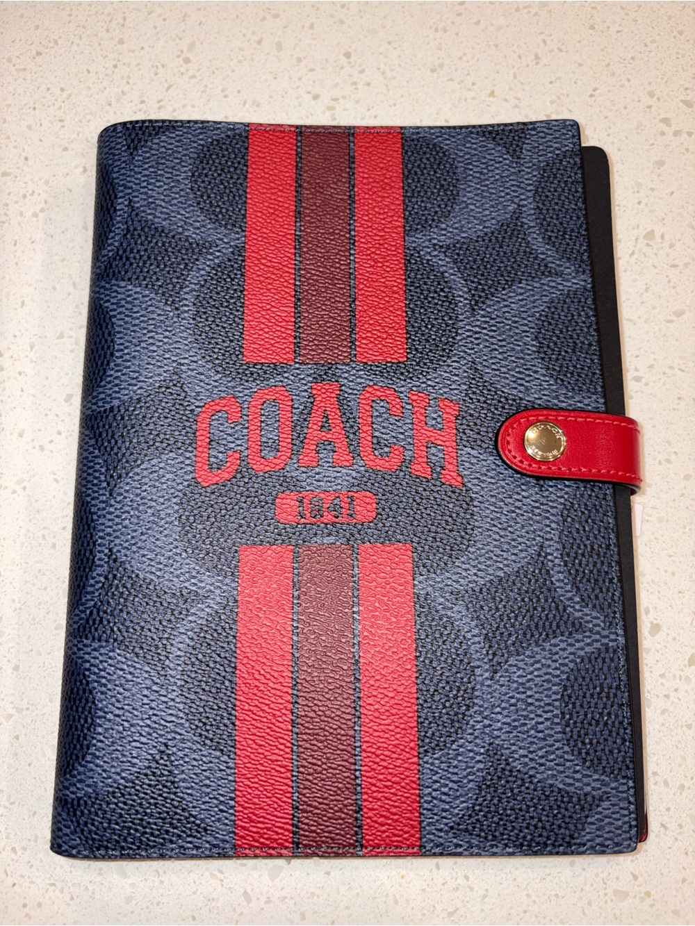Coach Navy Signature Canvas Notebook with red stripe and red lettering